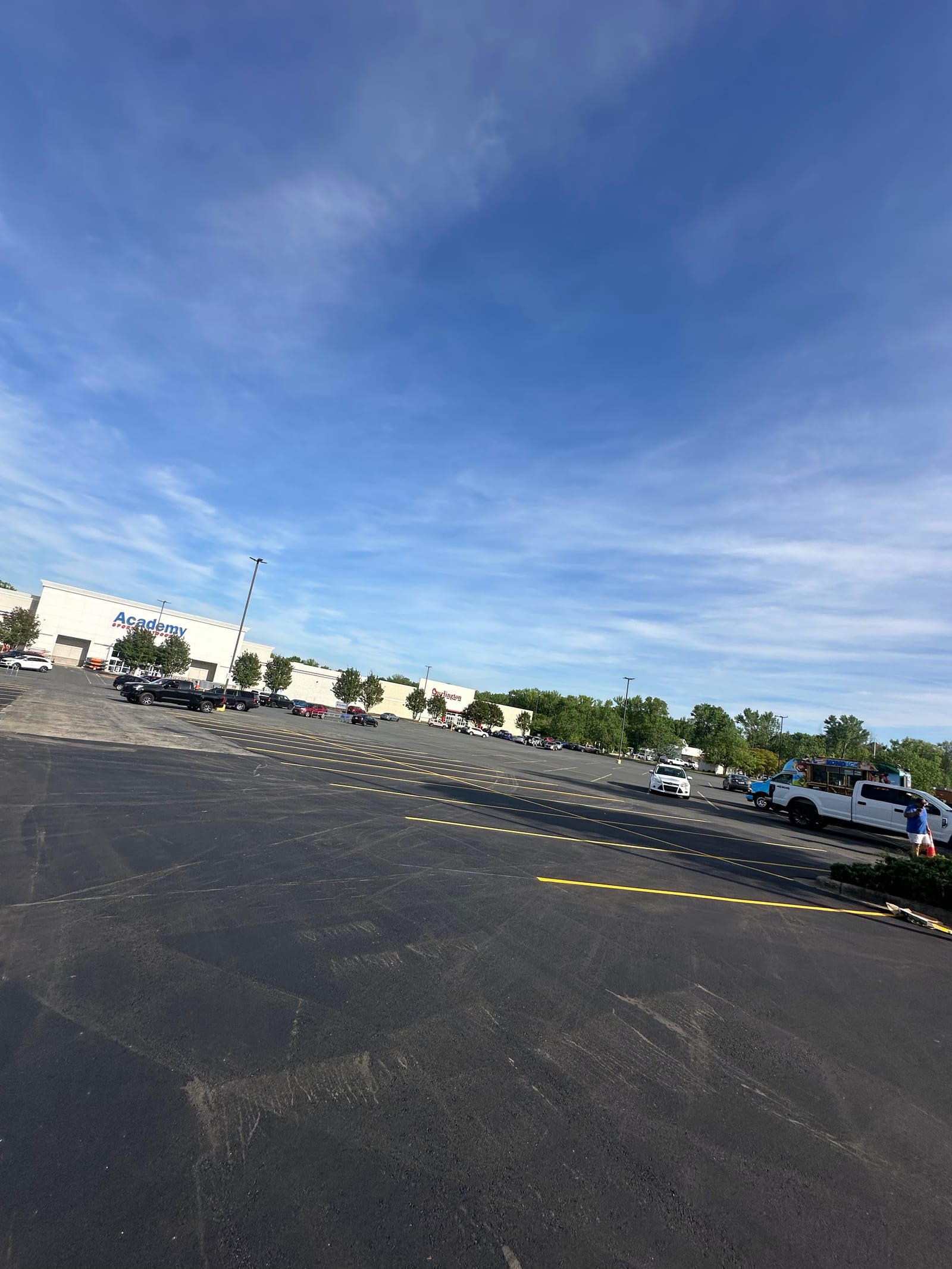 Large Academy Sports parking lot paving and striping in Gastonia NC