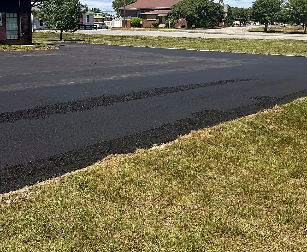 Fresh black asphalt on a newly paved commercial parking area in North Carolina
