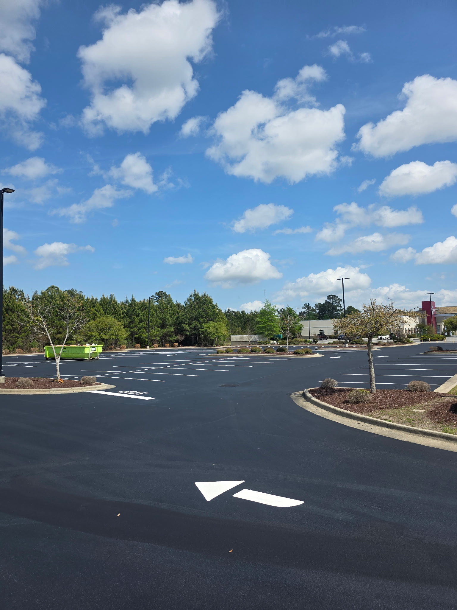 Directional arrow striping on fresh asphalt in Charlotte NC
