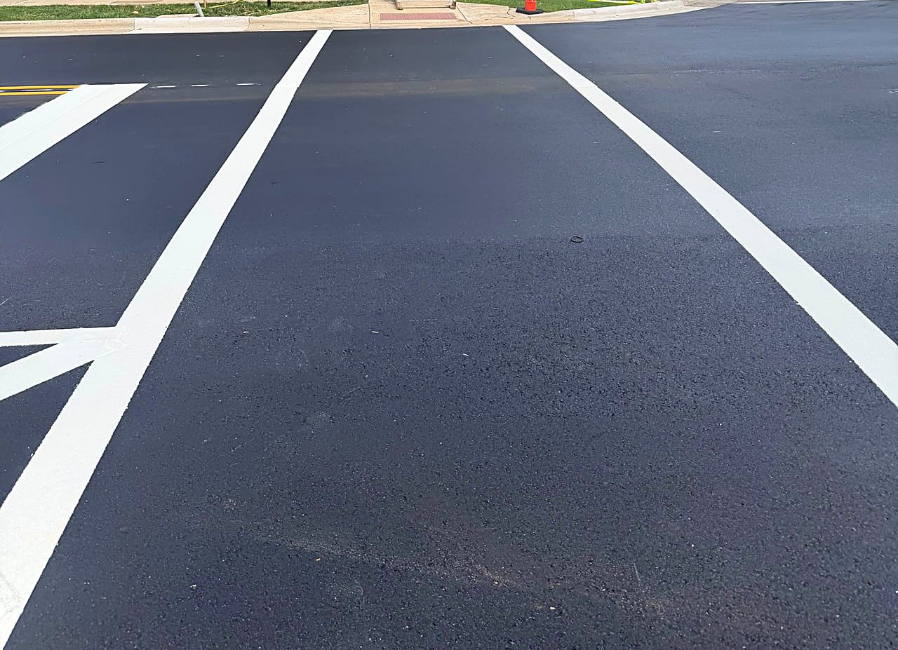 Freshly paved downtown street with new crosswalk line striping in Kannapolis, NC
