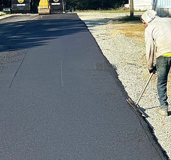 Around Town Paving crew finishing a freshly paved private community road in North Carolina
